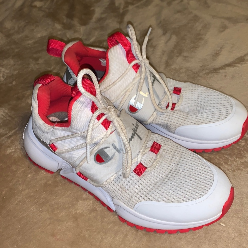 Red, White, and silver size 10 Champion woman shoes.